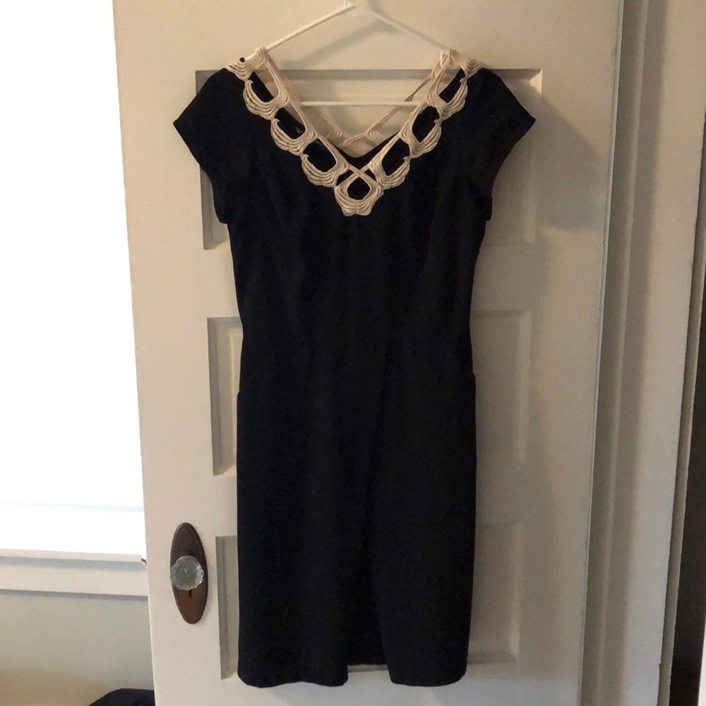 Black dress with white lace.